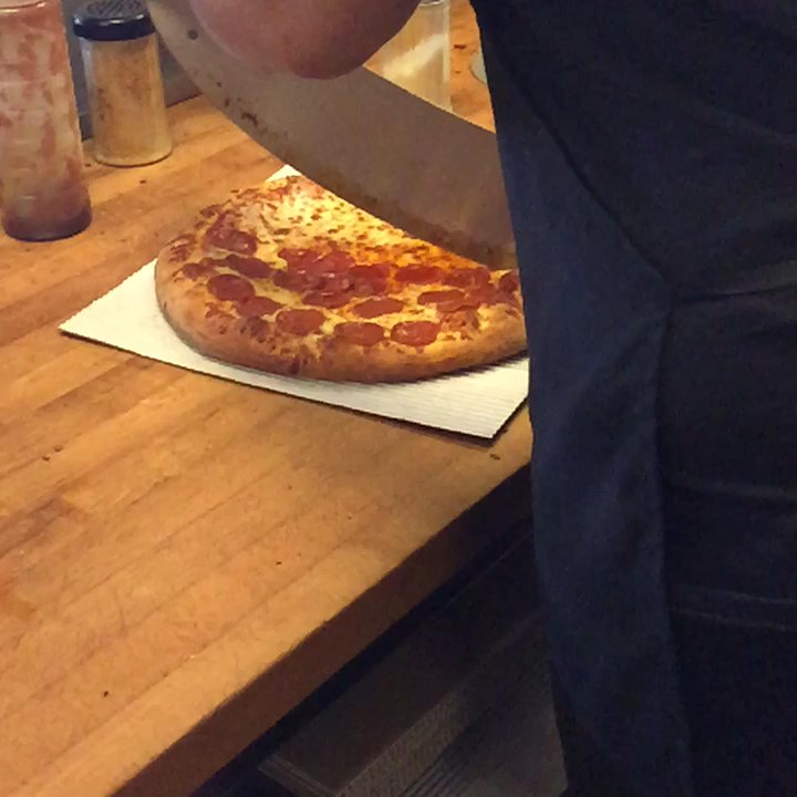 Marco's Pizza - Watching the fresh out the oven pizza (in all it's cheesy, crisp, fresh gloriousness) getting sliced to perfection! - Pizza Near Me - Cedar Park, Texas