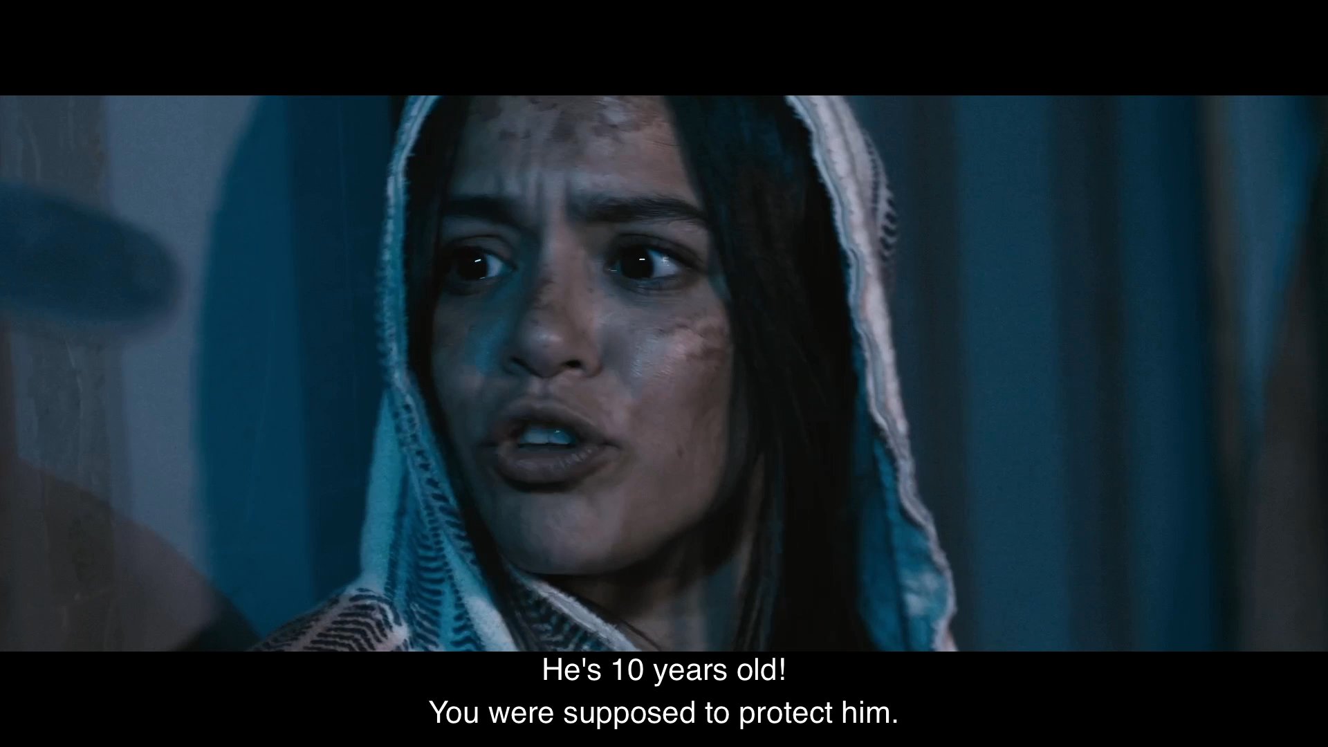 Two individuals engage in a heated, emotional argument regarding the safety and choices of a ten-year-old boy named Enrique. The dialogue focuses on themes of protection, personal responsibility, and perceived cowardice.