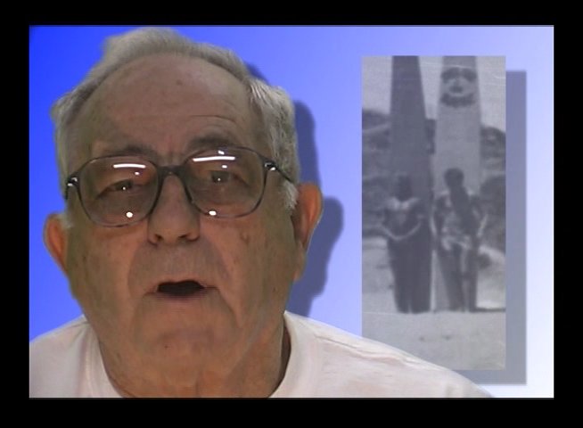 An elderly man shares personal reflections while archival photographs from his past are displayed alongside him. The sequence captures his evocative storytelling, contrasting his current appearance with historical imagery of his earlier life.
