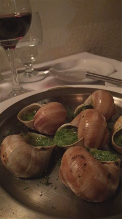 Le Petit Bistro - Sizzling escargots with to die for parsley buttery sauce (must dip with hot slices of french baguette!) - French Near Me - Mountain View, California