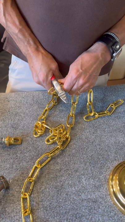 George's Lighting Plus - Carlos explaining in detail how to properly open a link to maintain the strength to hold our special chandelier - Lighting Fixtures & Equipment Near Me - Los Angeles, California