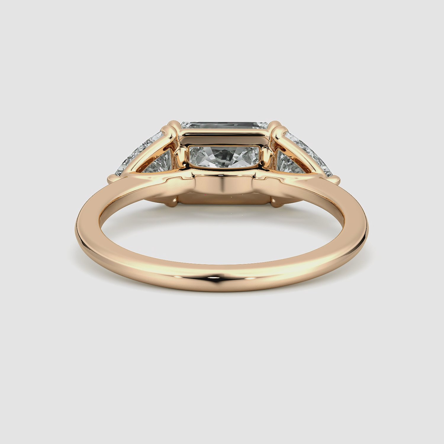 The Three Stone | Radiant | 14k | Rose Gold | bandAccent: Plain | diamondOrientation: horizontal | sideStoneCarat: 0.50ct | sideStoneShape: Trillion | caratWeight: other