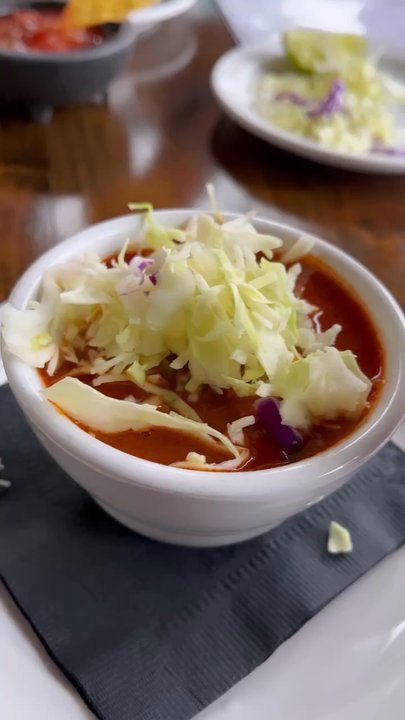El Adobe - A cup of red sauce pozole. It was served with cabbage, lime and it had the perfect amount of spice. I also love their chips and salsa. - Latin American Near Me - San Juan Capistrano, California