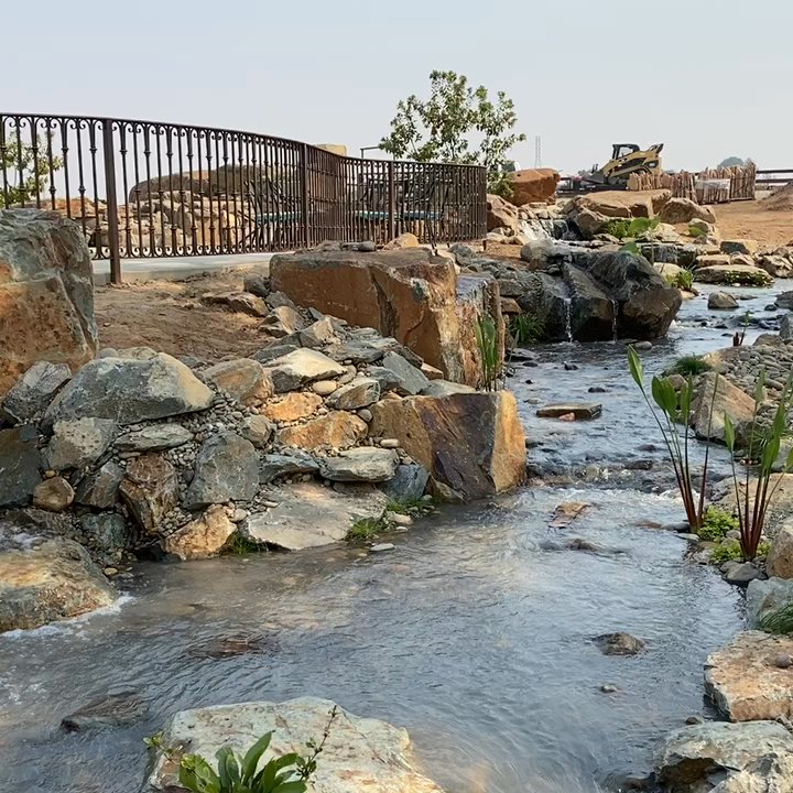 Rockface Waterscapes - This 185' long creek has waterfalls, lights, water plants, a small pond, 30k gph & of course large boulders. - Landscaping Near Me