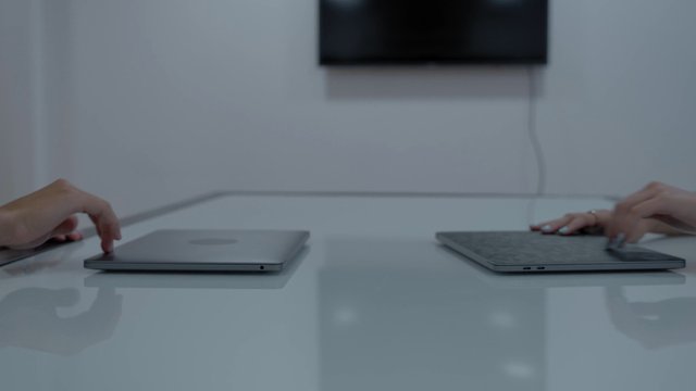 Workers typing and closing their laptops