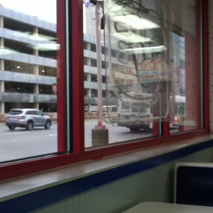 Burger King - Advocate Hospital parking garage outside with large interior and a children's play area through the doors. - Burgers Near Me - Oak Lawn, Illinois