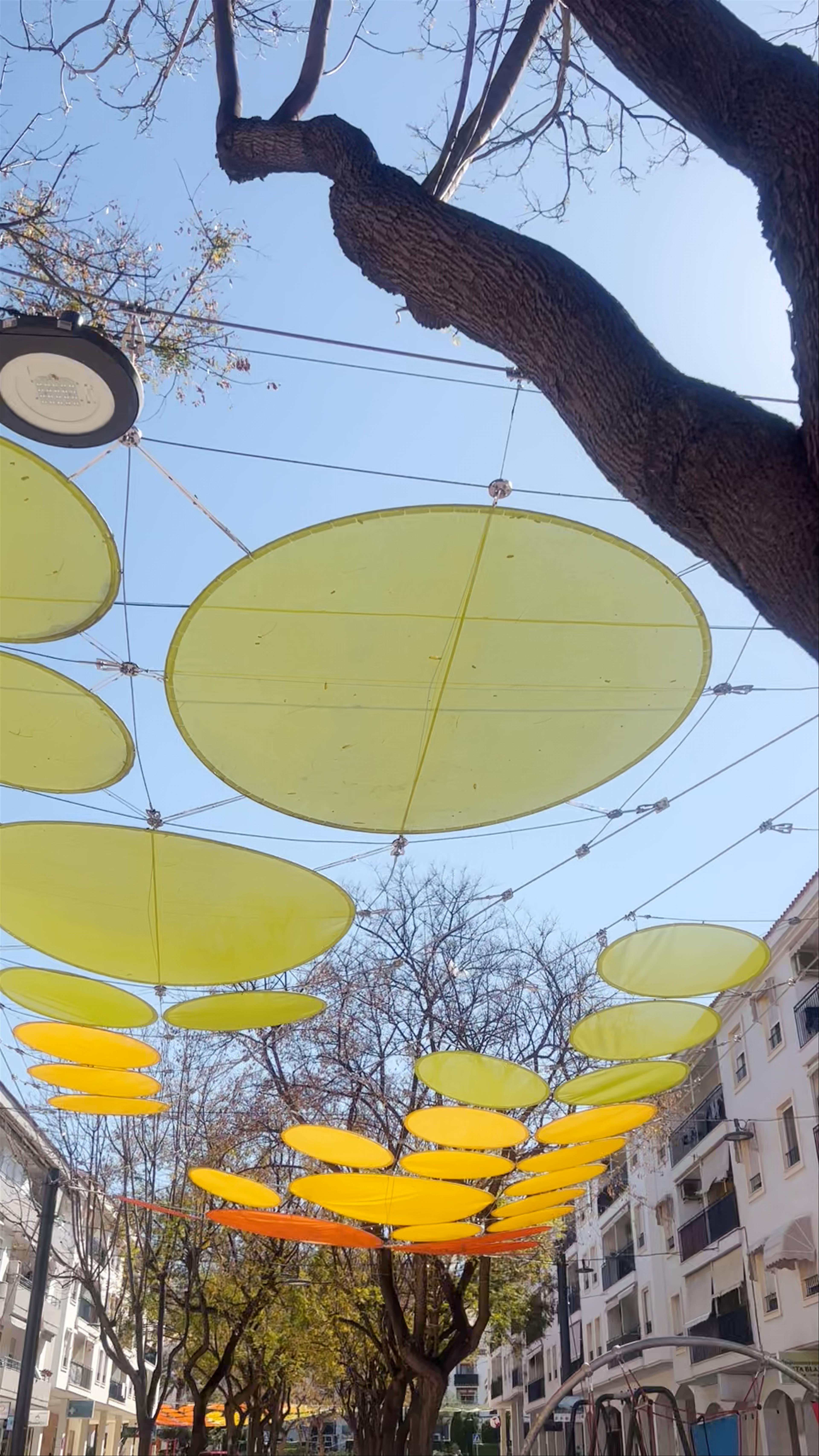 Sunny Afternoon Stroll Under Colorful Canopies at Parc Comunitat Valenciana, Altea