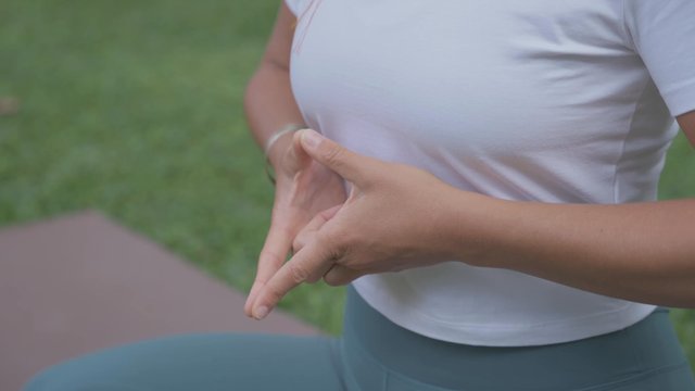 Woman's hands in the soaring lotus mudra formation