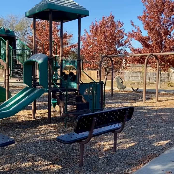 John M Whisenant Park - John M. Whisenant Park -- view rounding the side of the smaller playground and swings - Parks Near Me - McKinney, Texas