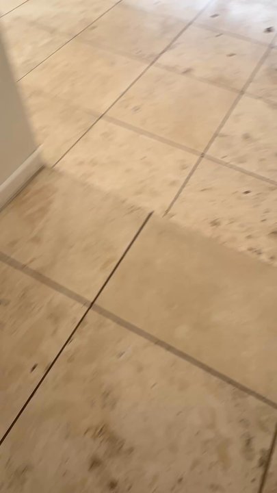 Grout Works - Before-view of stone floor pit fill, tile and grout clean, seal grout and tile. - Grout Services Near Me
