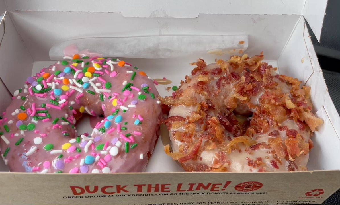Duck Donuts - Fresh and WARM right in the box! Strawberry Easter Confetti (Seasonal flavor) and Bacon in the Sun (Maple Bacon "Fan Favorite" flavor) - Donuts Near Me - Nags Head, North Carolina