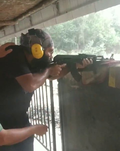 Photo of Hands on AK-47 in Vi