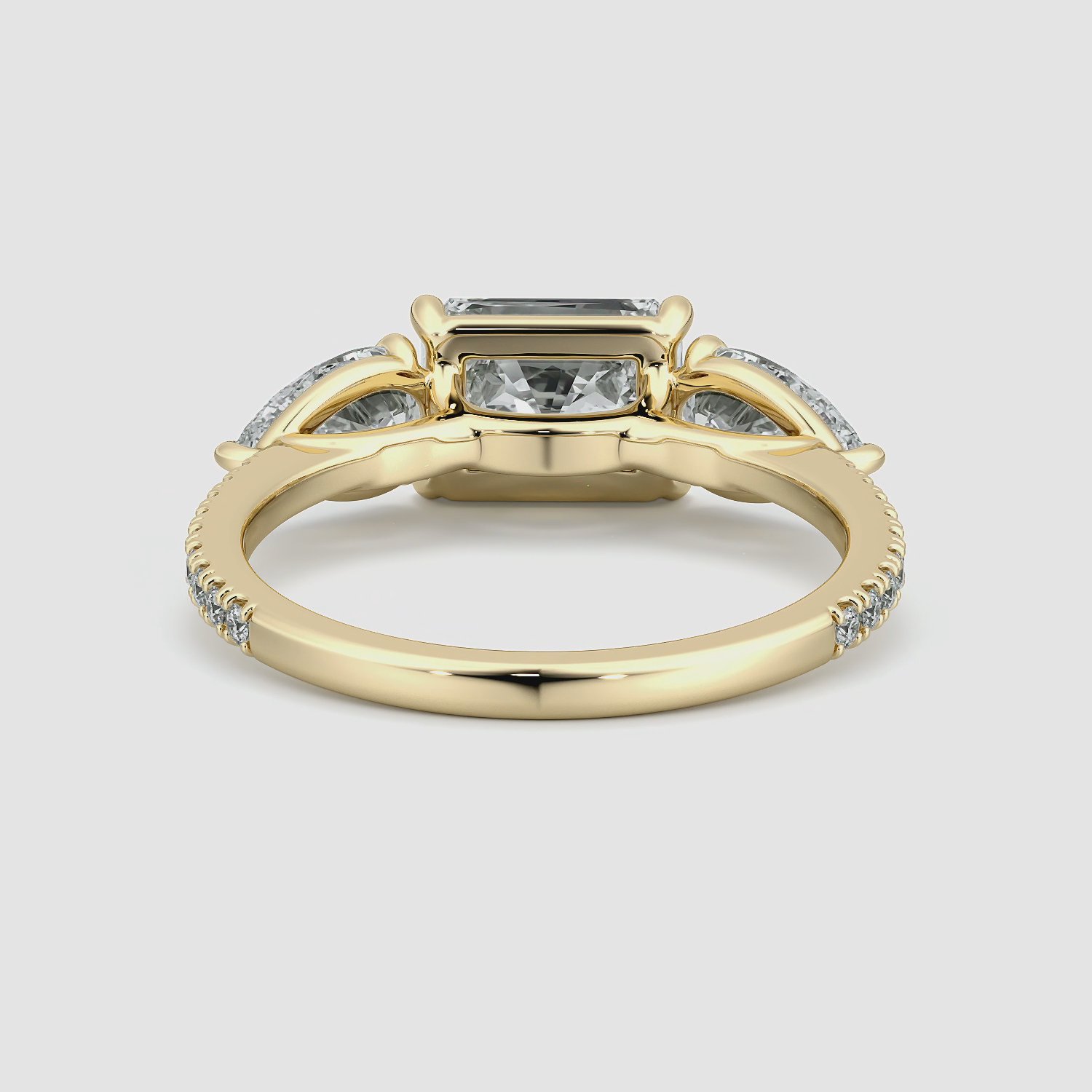 The Three Stone | Radiant | 18k | Yellow Gold | bandAccent: Pavé | diamondOrientation: horizontal | sideStoneCarat: 0.50ct | sideStoneShape: Pear | caratWeight: other