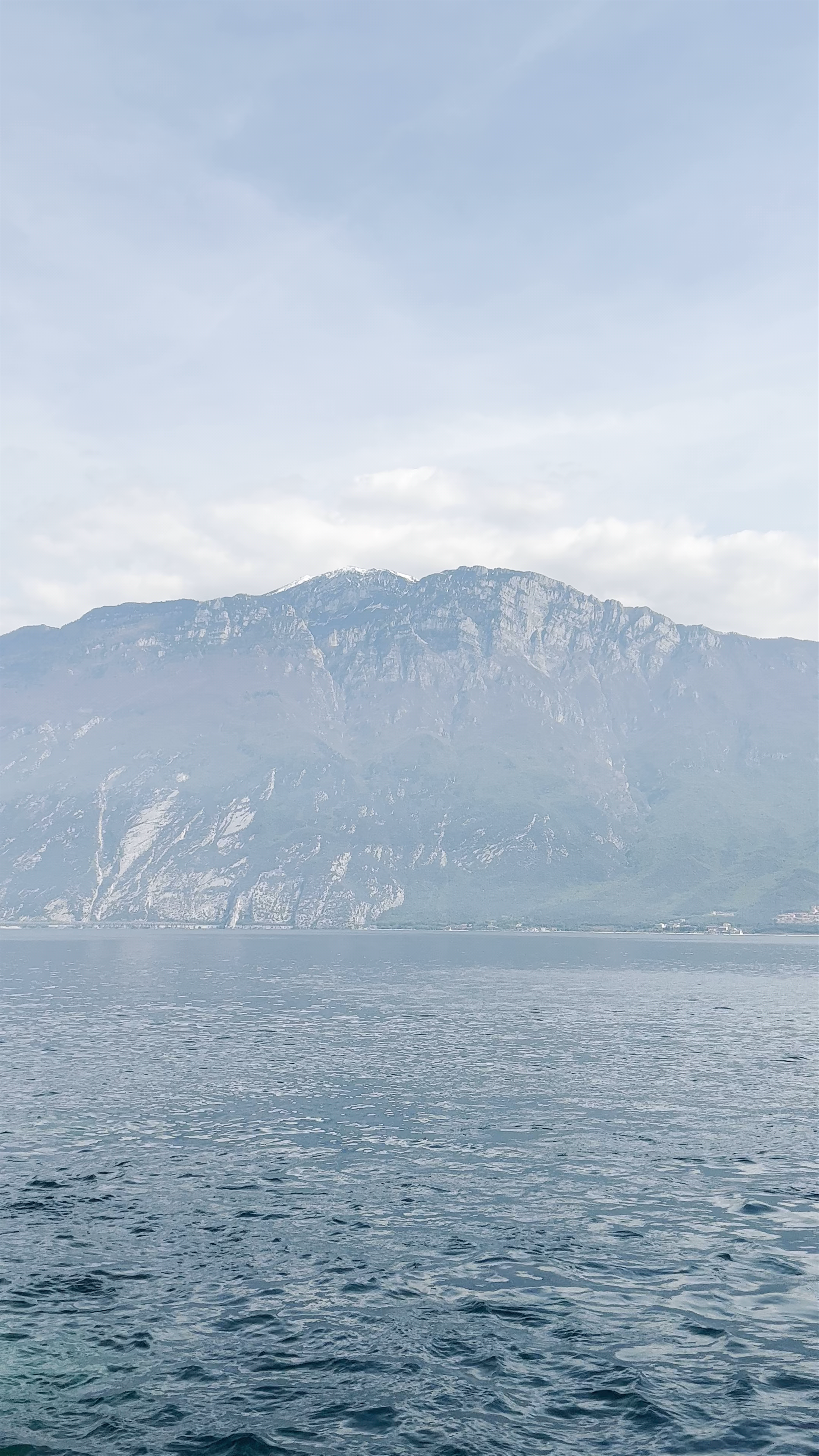 Tranquil Lake and Majestic Mountains at Limone Sul Garda