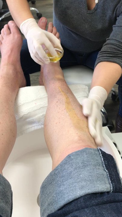 Premium Nail Salon - Daiana adds the warm oil for the leg and hot stone massage in the Premium pedicure. - Nail Salons Near Me - Glendora , California