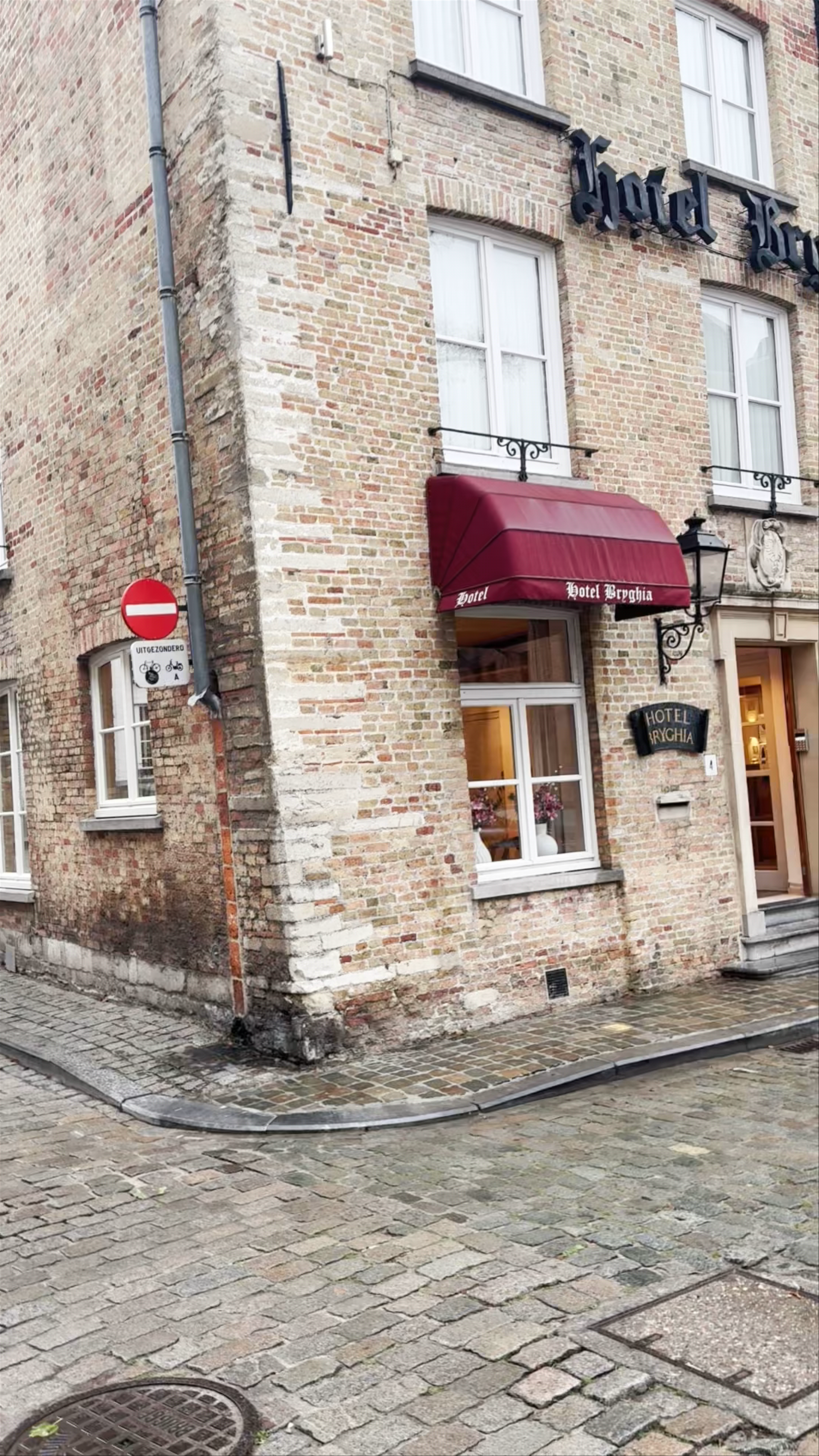 A Charming Stroll Past Hotel Bryghia on Cobbled Streets in Bruges