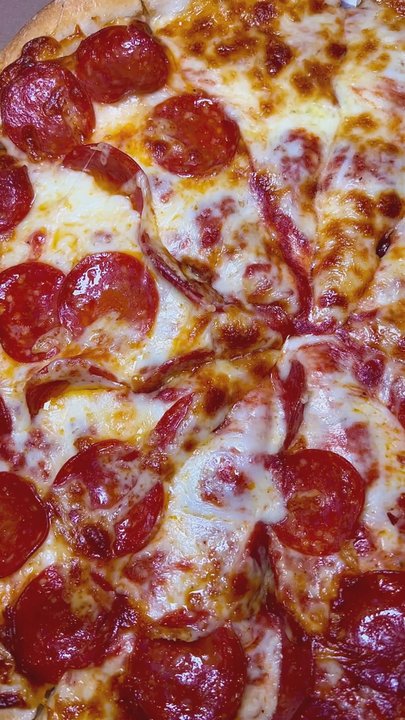 Marathon Pizza House - Grabbing a cheese slice from medium cheese pizza, half w/ pepperoni; Greek style, good cheese & sauce, crispy crust, verra nice - Pizza Near Me - New Britain, Connecticut