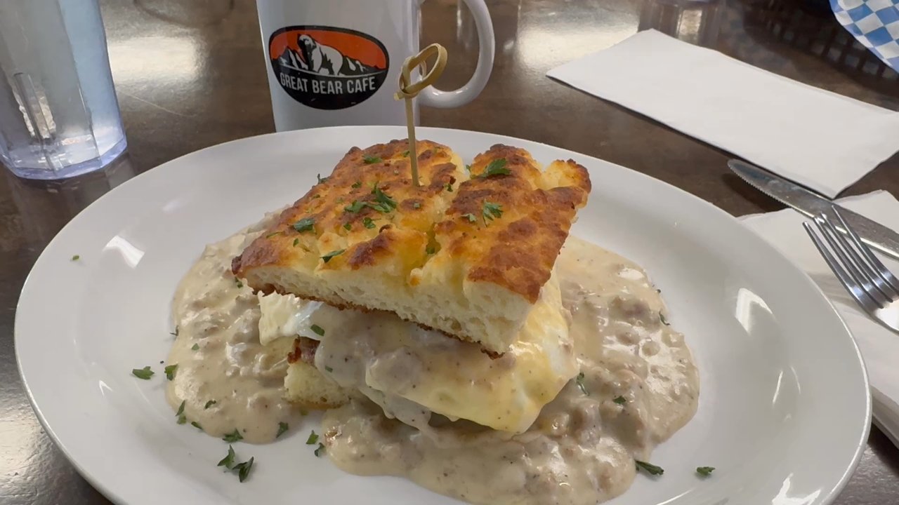 Great Bear Cafe - This sausage gravy biscuit breakfast sandwich definitely deserves a chefs kiss - Cafes Near Me - Hungry Horse, Montana