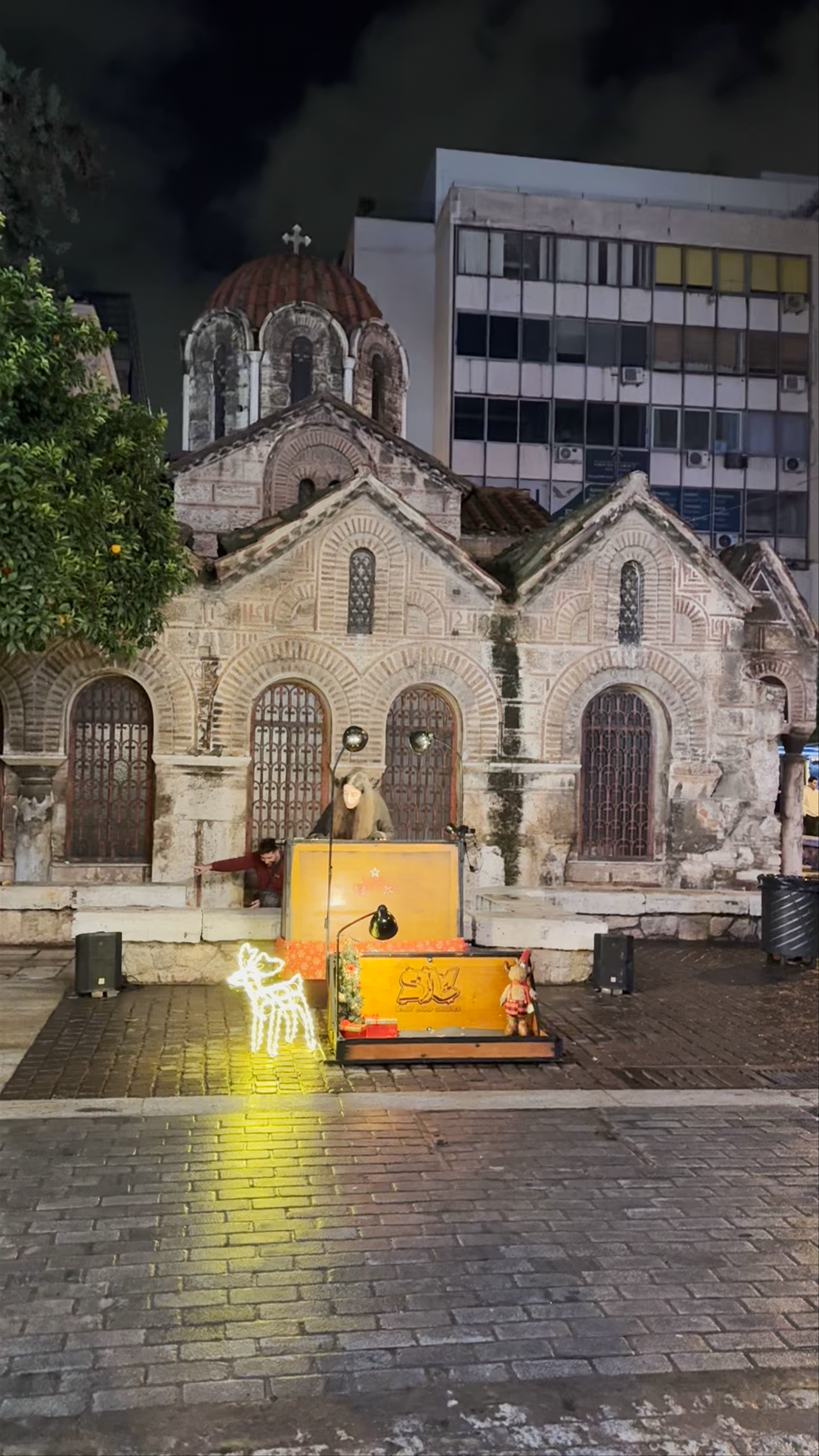 Nighttime Street Performance at Panagía Kapnikaréa Church, Athens