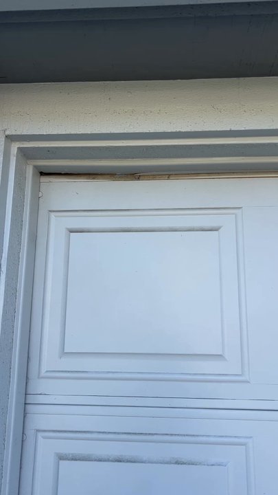 Local Garage Doors - You can see that the left side is lower now then the right - Garage Door Services Near Me