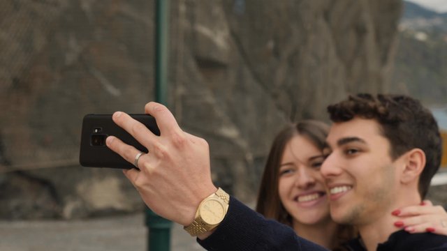 Couple taking a selfie and kissing