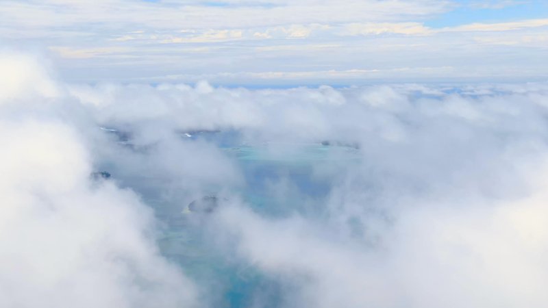 Through the Clouds in the Gambier Islands poster