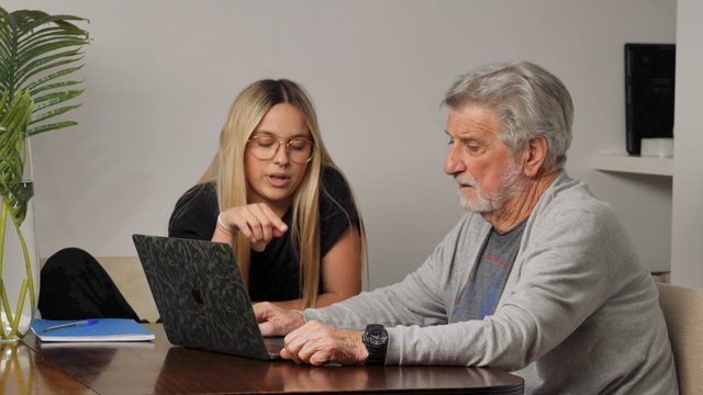 Grandfather and granddaughter talking