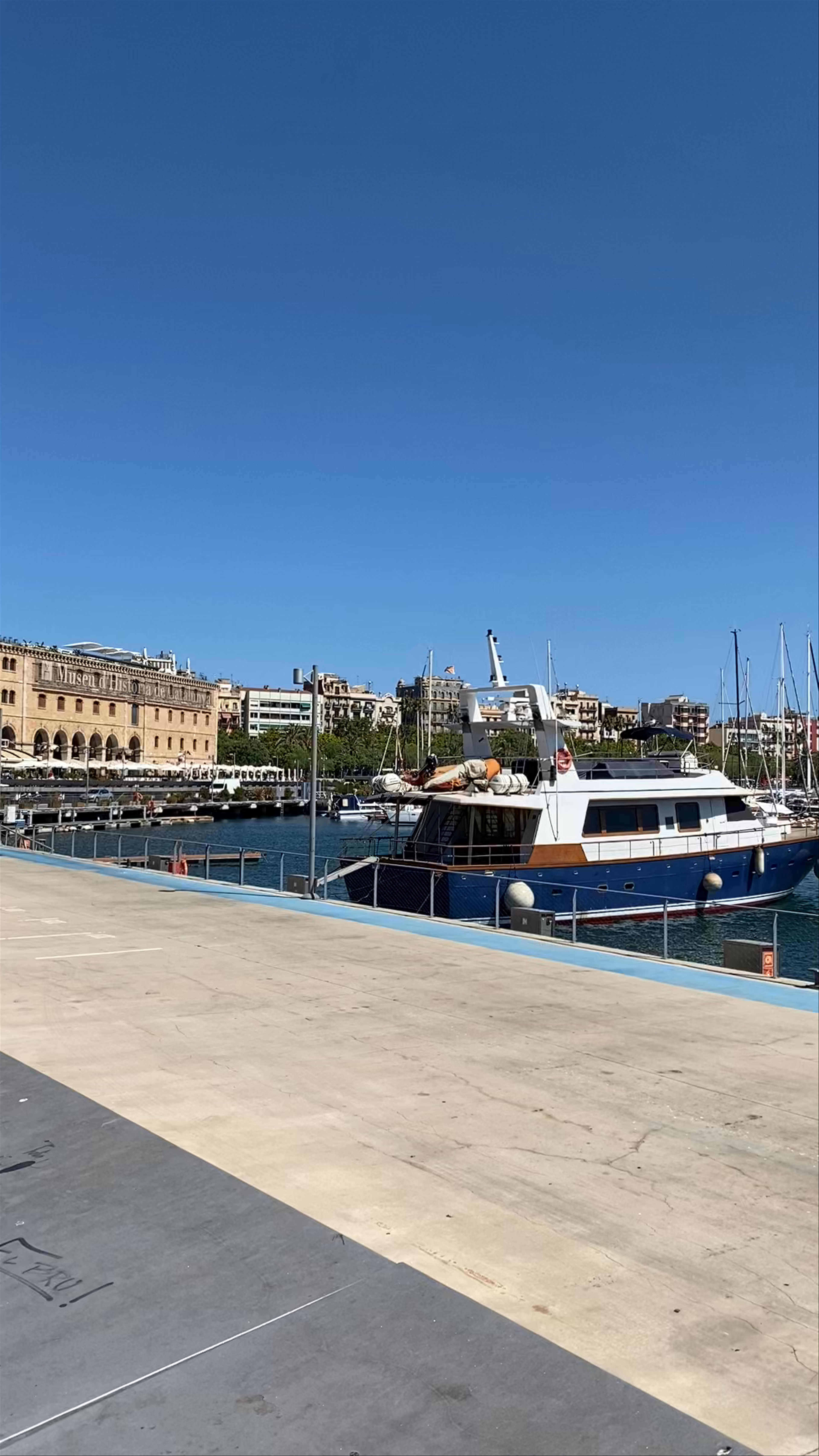Port Vell: Sunny Yacht Dock in Barcelona's Iconic Harbor