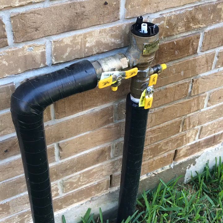Lawnscaping Plus - Spraying water on the main valve pipe - Landscaping Near Me - Houston, Texas
