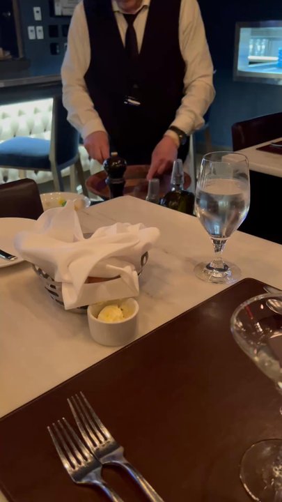 Caucus Club - The waiter preparing the table side Caesar salad. - Steakhouses Near Me - Detroit, Michigan