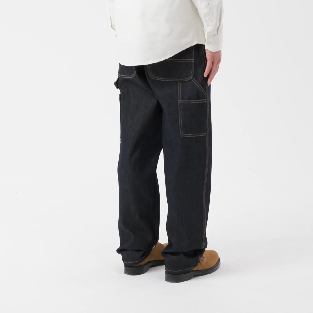 Mode wearing a pair of Single Knee Pants in Denim Blue Rigid