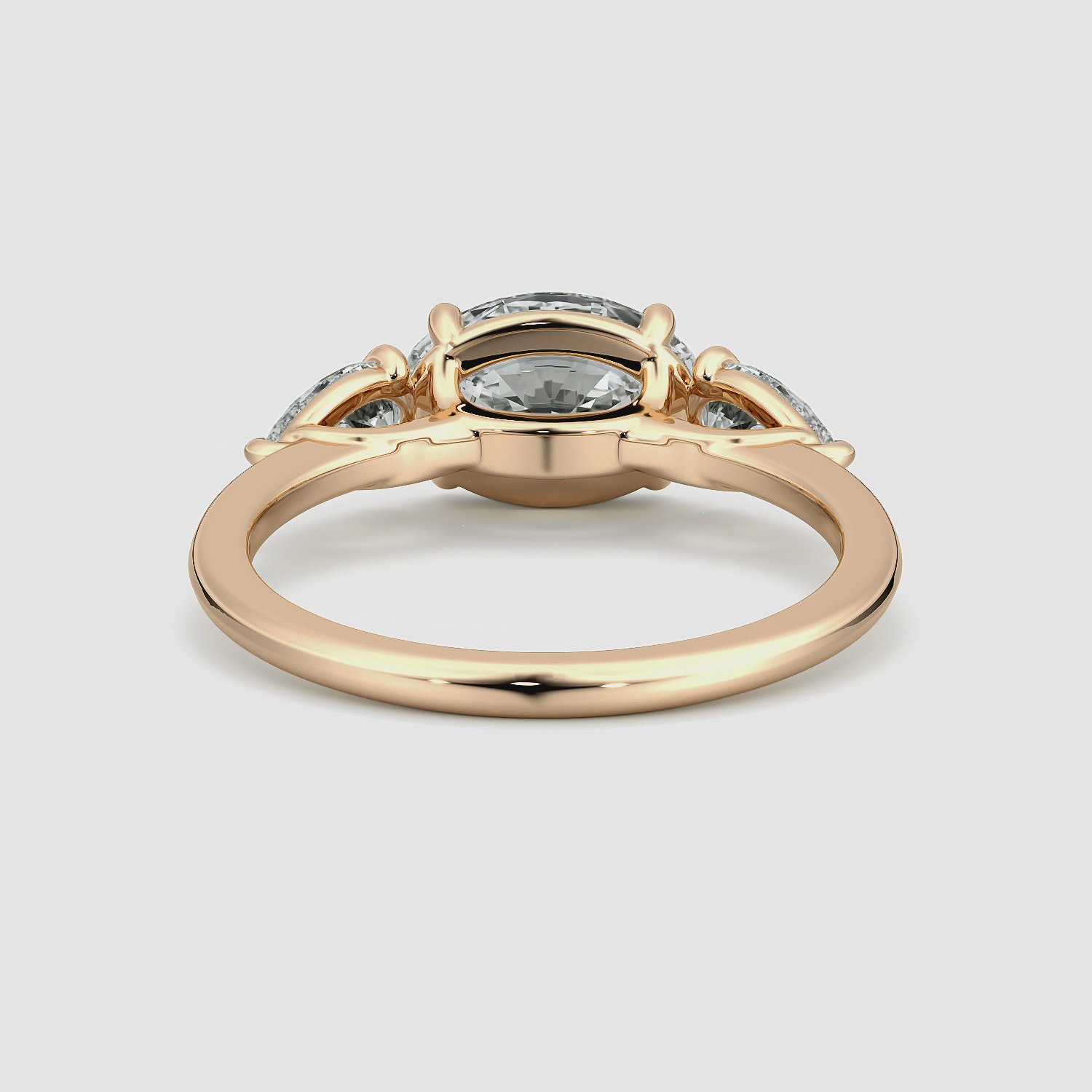 The Three Stone | Oval | 14k | Rose Gold | bandAccent: Plain | diamondOrientation: horizontal | sideStoneCarat: 0.25ct | sideStoneShape: Pear | caratWeight: other