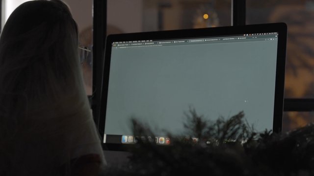 A girl downloading a Christmas picture on her computer