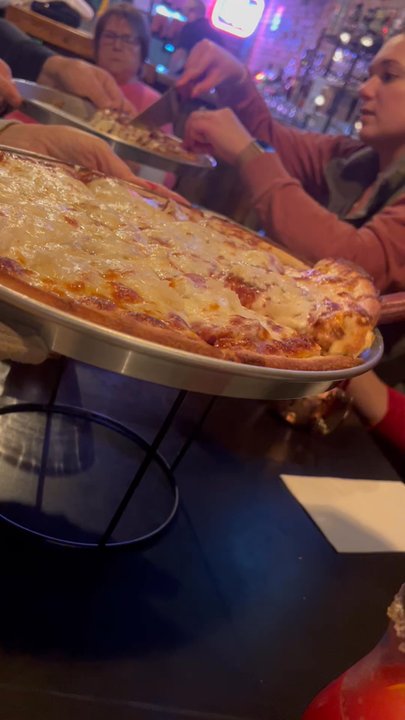 Brickroad's Grille - Epic cheese pull! - Pizza Near Me - Clarks, Nebraska