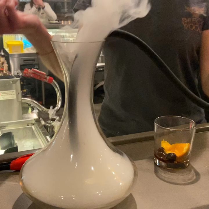 Beechwood Grill - Bartender Gillian making a handcrafted "campfire" cocktail! - Seafood Near Me - Holland, Michigan