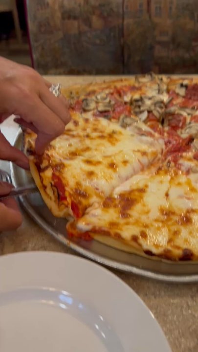 Pacific Pizza - Cheese pull - Pizza Near Me - Forks, Washington