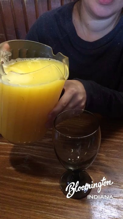 Runcible Spoon Cafe & Restaurant - Mimosa pitcher in action - Coffee & Tea Near Me - Bloomington, Indiana