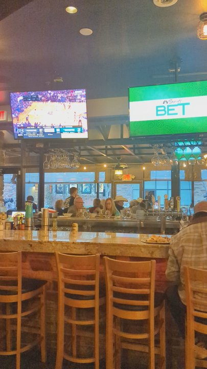 Charred Pie - Inside bar windows wide open to outdoor courtyard, live music by Century 16 Thursday evening. Open kitchen, bar and dining room 3-14-2024 - Pizza Near Me - Oro Valley, Arizona