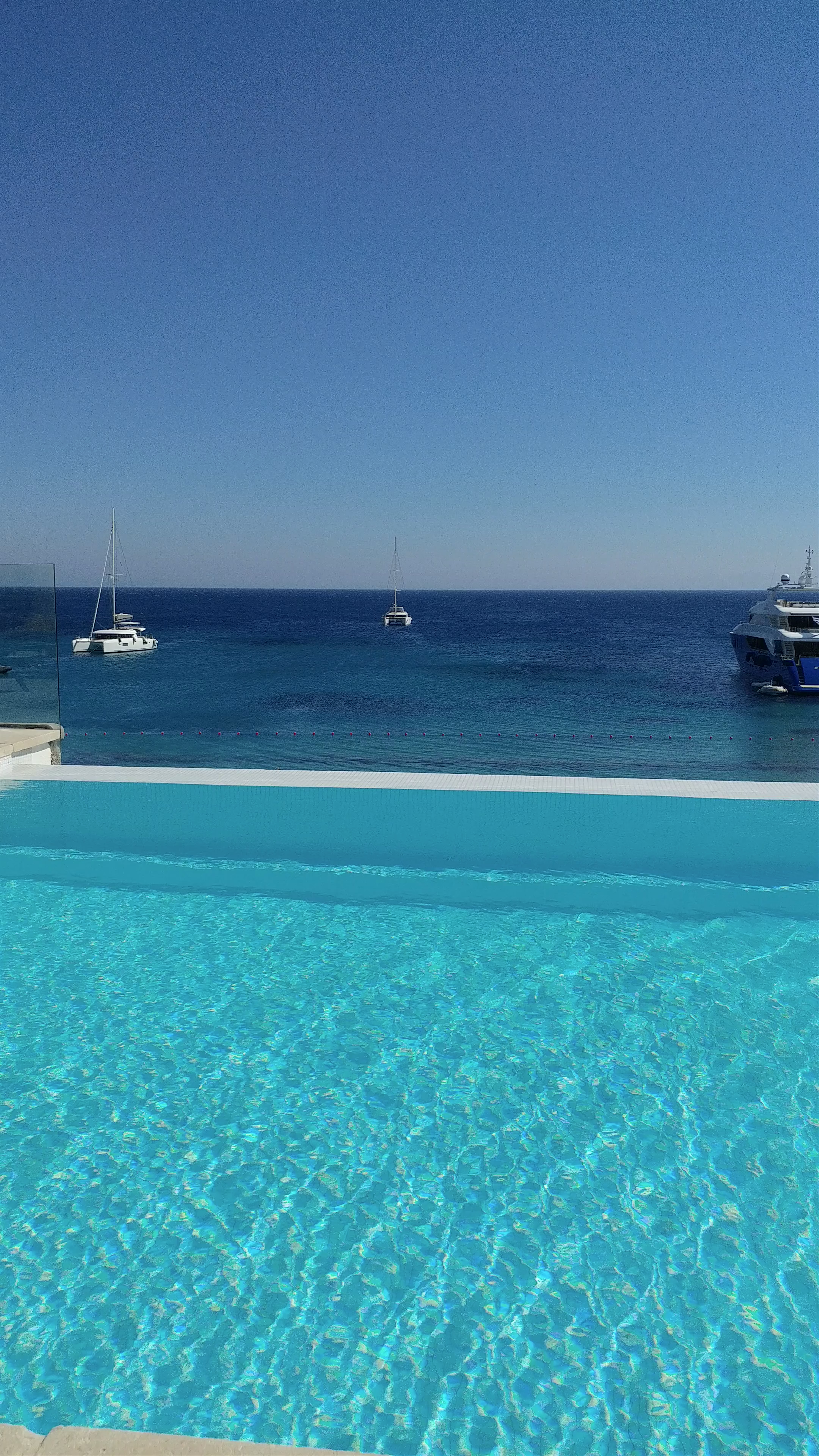 Serene Infinity Pool Overlooking the Aegean Sea in Ornos, Mykonos
