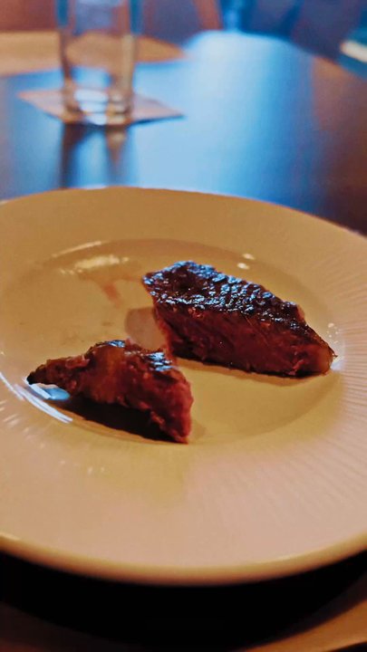 Hemlock - Peppercorn Hemlock sauce covering pieces of 16 oz Prime Ribeye medium rare - Steakhouses Near Me - Boise, Idaho