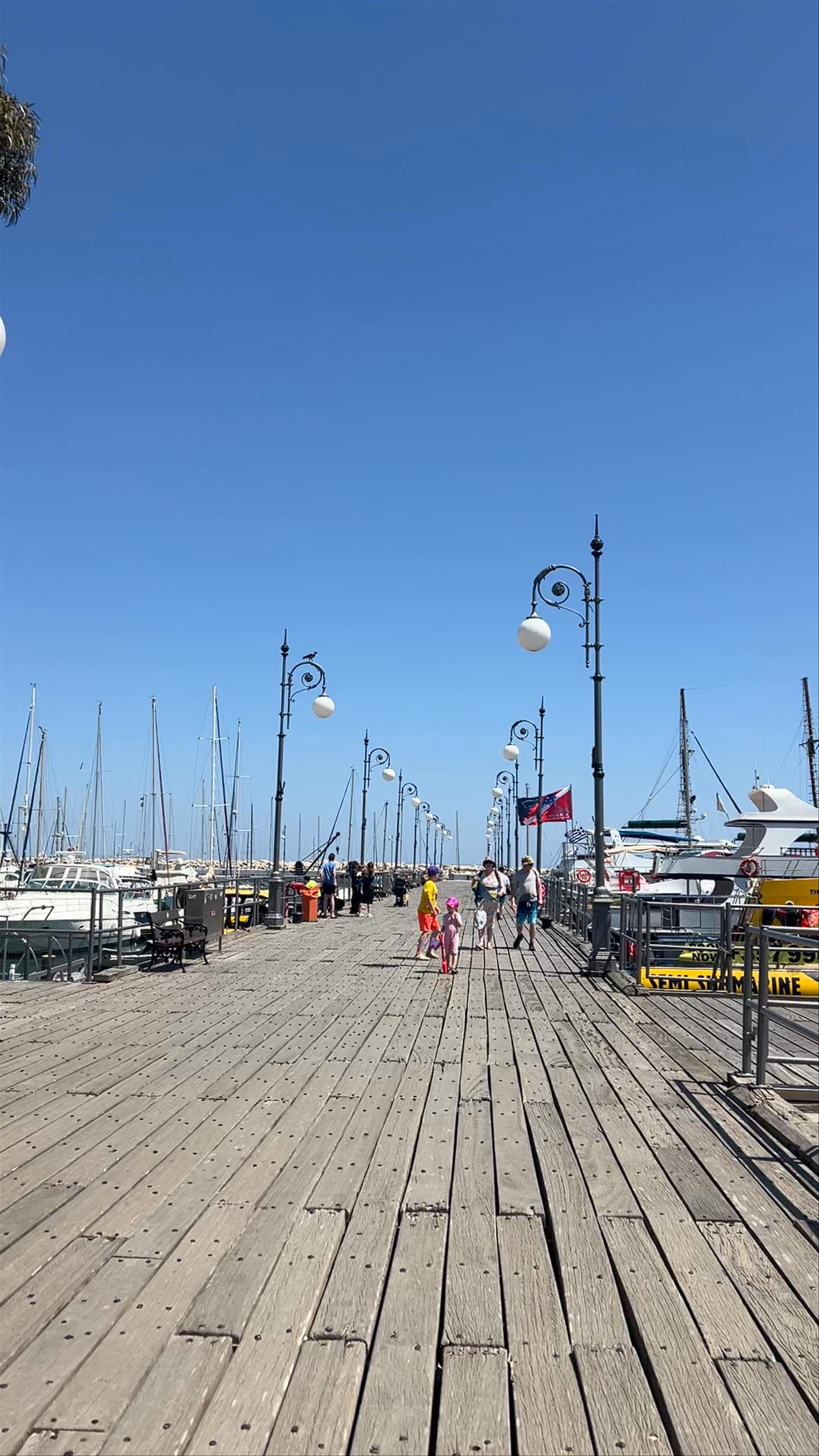 Sunny Stroll Along Larnaca Marina Boardwalk