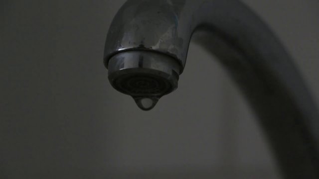 Water dripping from the faucet 