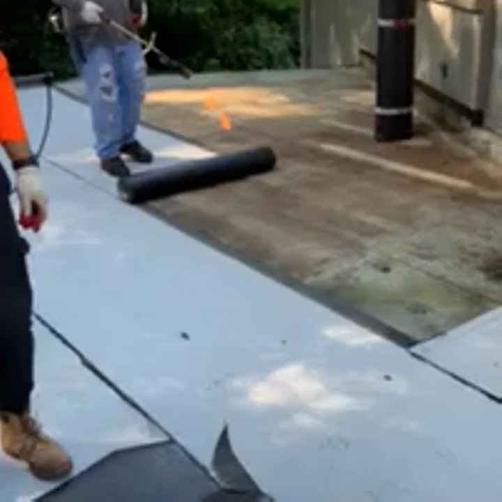 Kelbie Home Improvement - Workers installing a torch down modified roof - Roofing Near Me - Washington, DC, District of Columbia