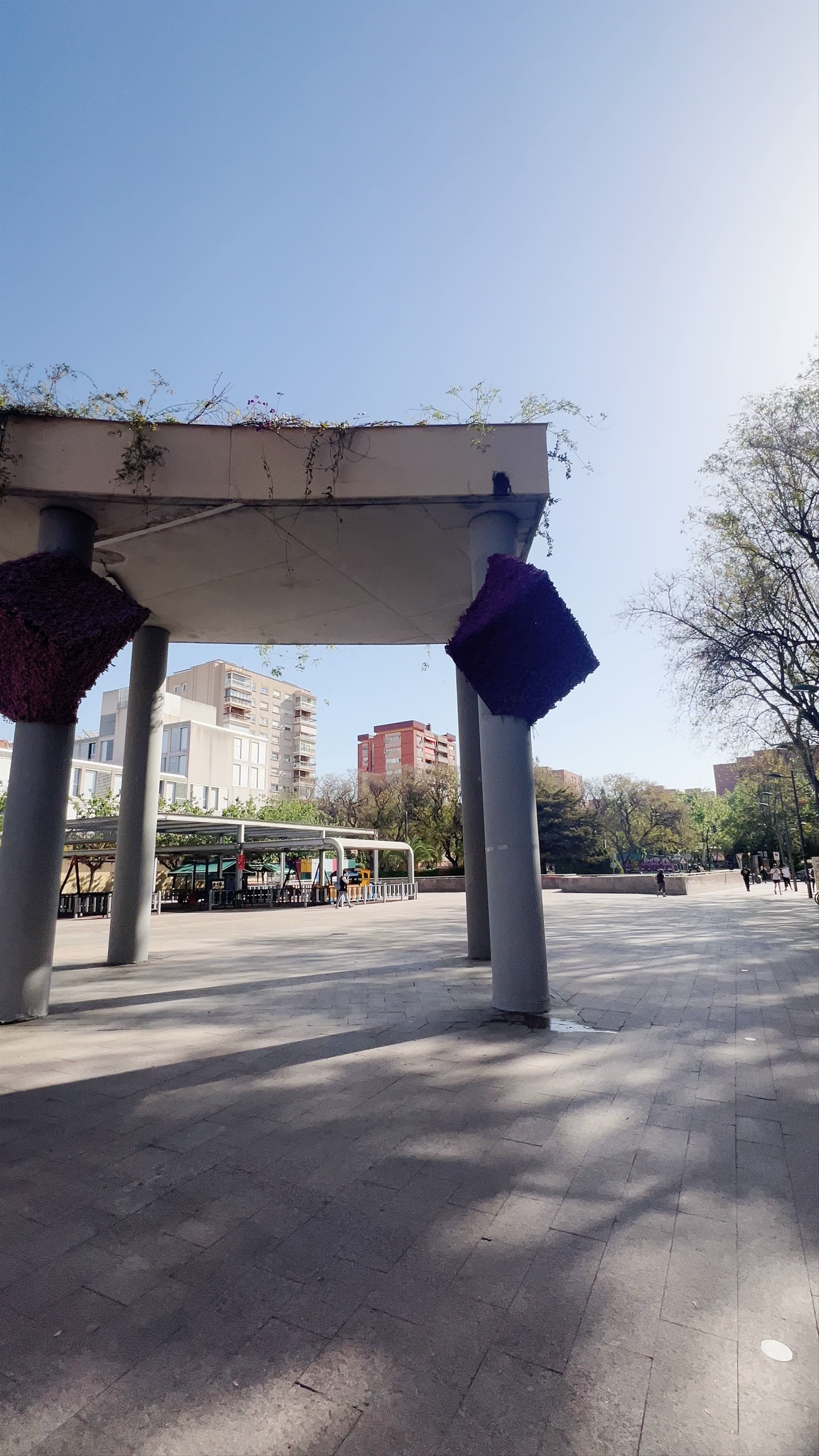 Sunlit Stroll Through Plaza de la Universidad in Murcia, Spain