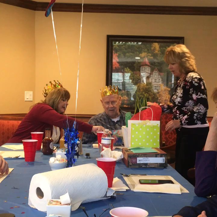 Wyndham Lakes - Dad opening his gifts. - Assisted Living Facilities Near Me - Jacksonville, Florida