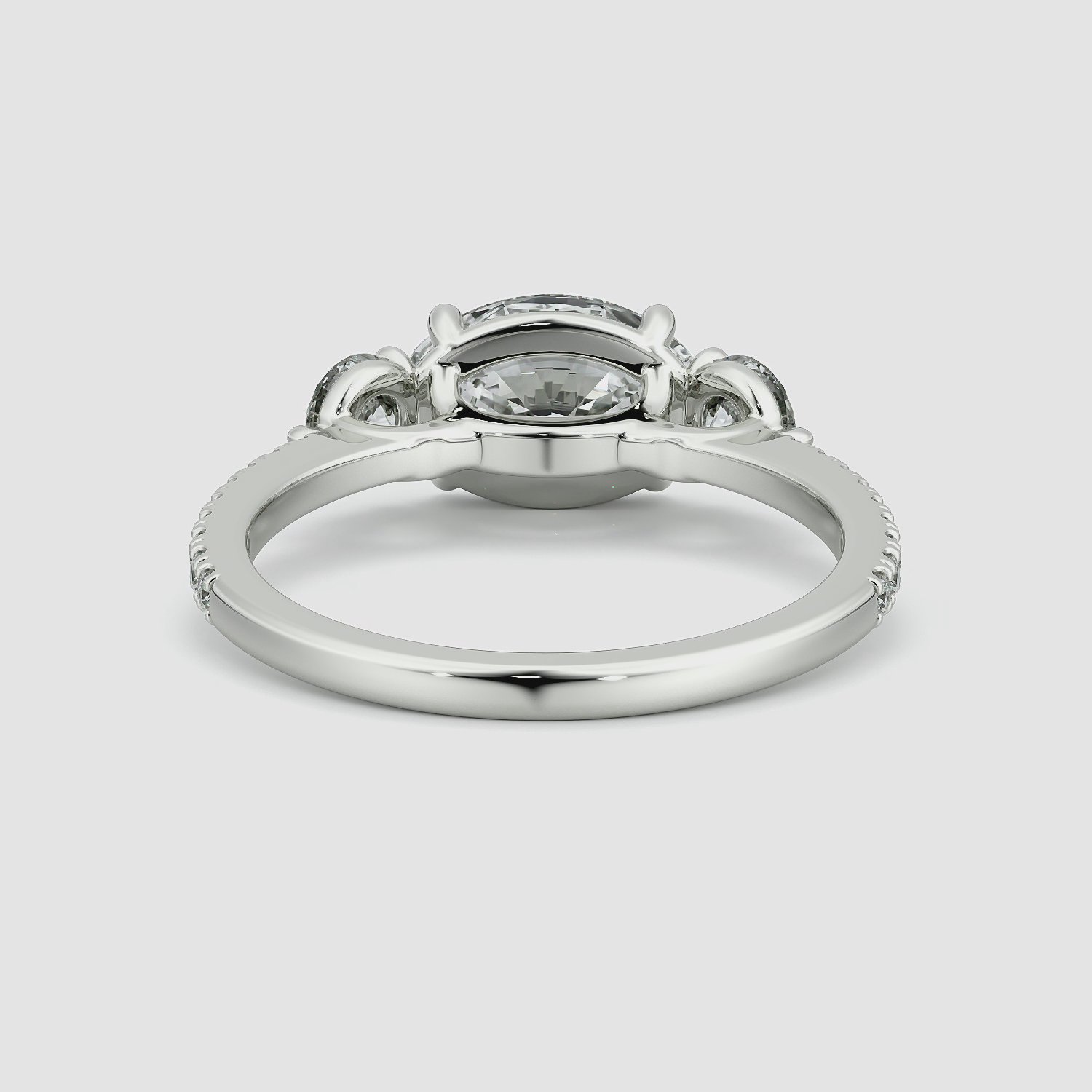 The Three Stone | Oval | 18k | White Gold | bandAccent: Pavé | diamondOrientation: horizontal | sideStoneCarat: 0.25ct | sideStoneShape: Round Brilliant | caratWeight: other
