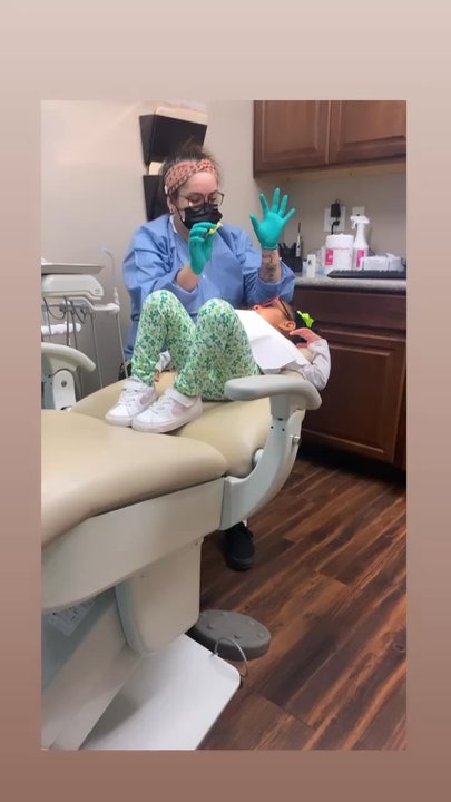 Austin Children's Dentistry - Anna walks Ava through the cleaning process - Pediatric Dentists Near Me - Leander, Texas