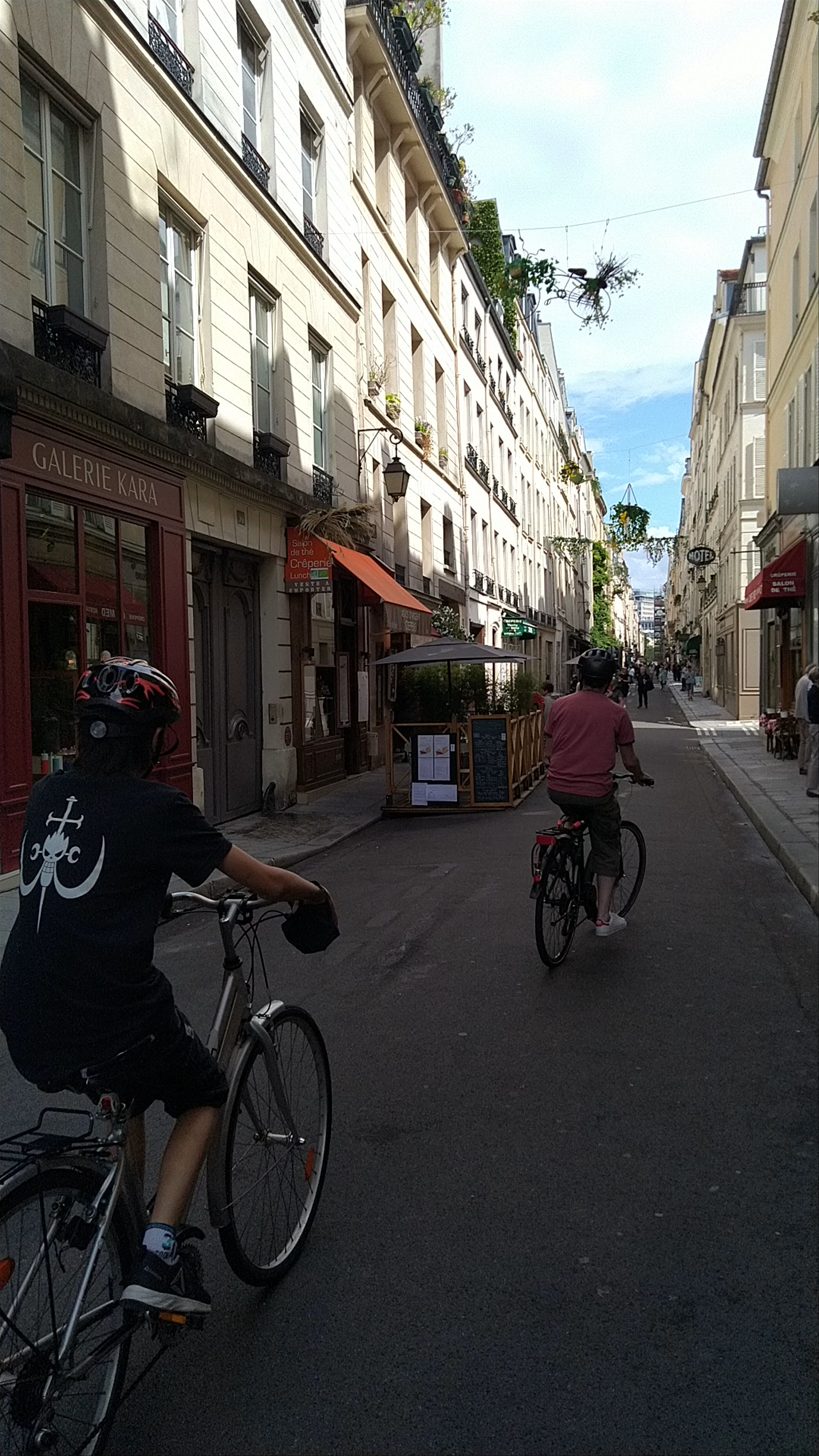 Charming Cycling along Rue Saint-Louis en l'Île, Paris