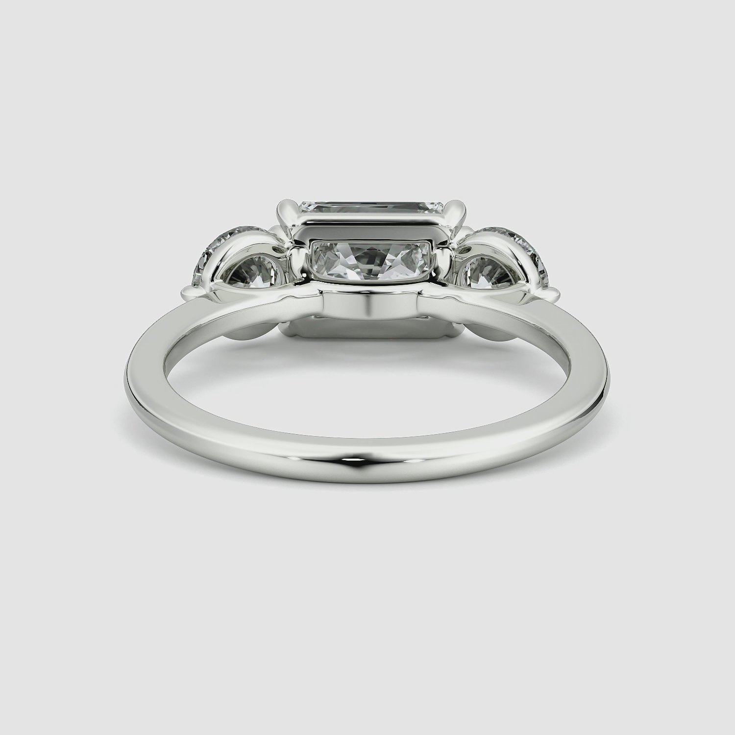 The Three Stone | Radiant | 18k | White Gold | bandAccent: Plain | diamondOrientation: horizontal | sideStoneCarat: 0.50ct | sideStoneShape: Round Brilliant | caratWeight: other