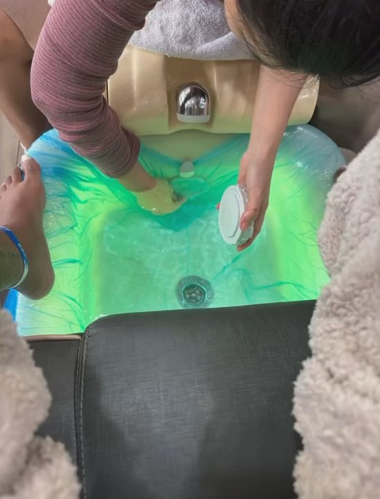 Infinity Nail Brookhaven - This is her cleaning the filter with her bare hands after my feet have been soaking it the bath for 40 minutes. - Nail Salons Near Me - Atlanta, Georgia
